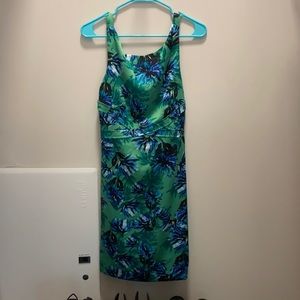 Green knee length dress with blue flowers